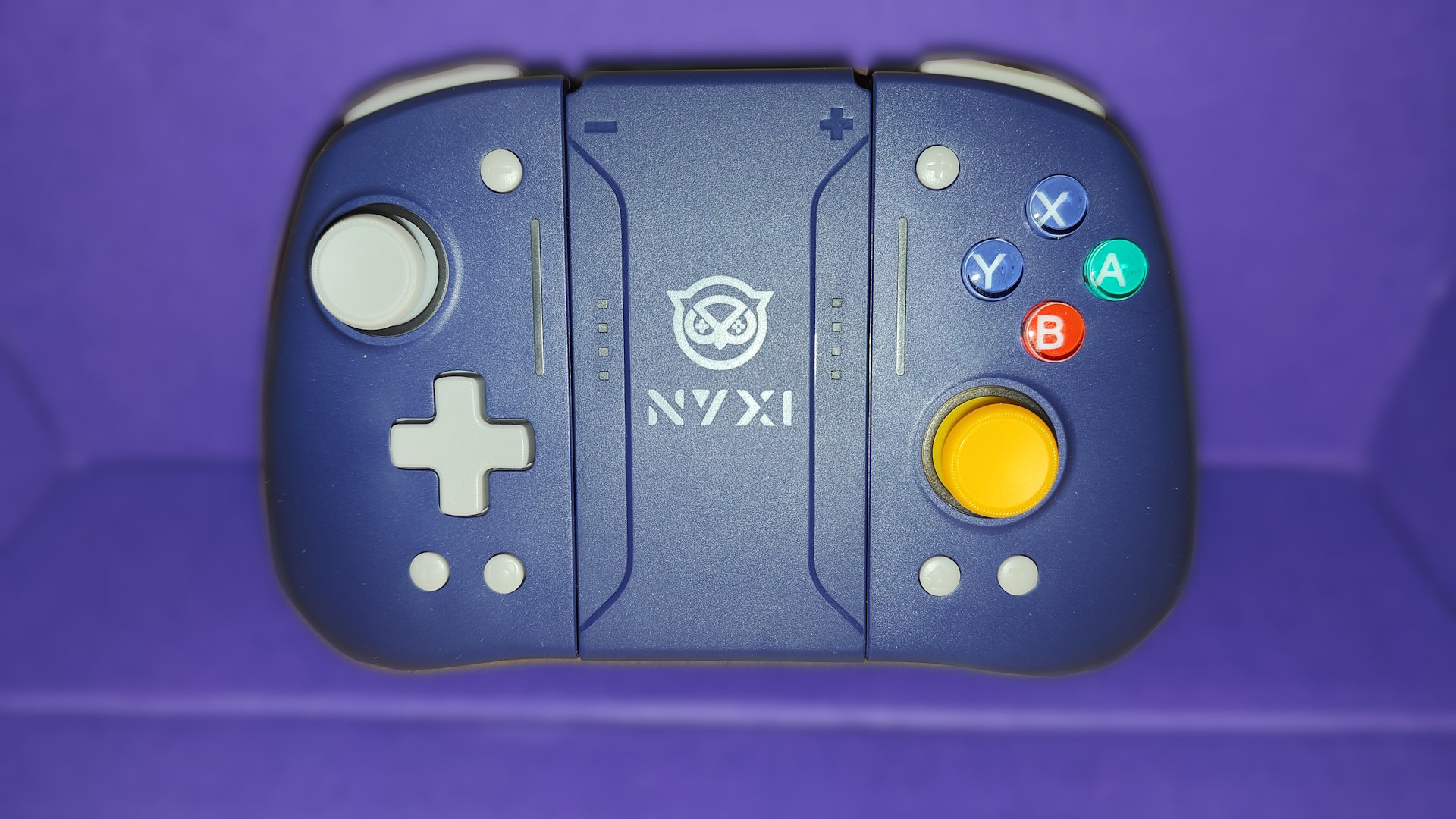 NYXI Hyperion Pro controller against a purple backdrop.